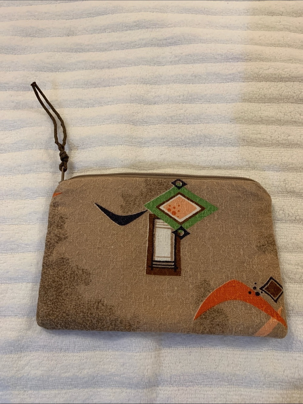 Neutral Brown Geometric Wristlet Clutch in Brown with Green & Orange Accents​​